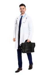 Full length portrait of medical doctor with handbag isolated on white