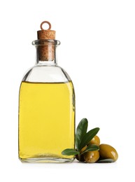 Photo of Glass bottle of oil, ripe olives and green leaves on white background