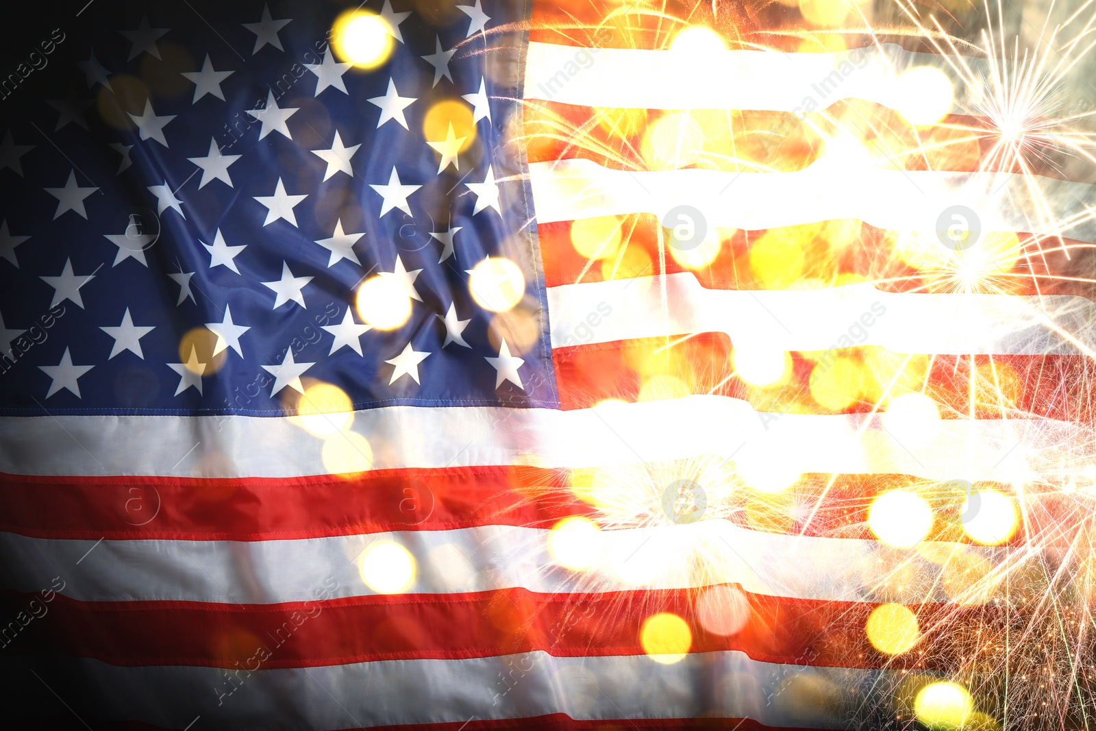 Image of Independence Day of USA. National American flag and fireworks, bokeh effect 