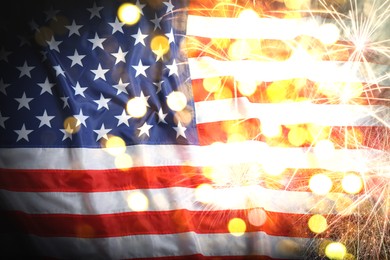 Independence Day of USA. National American flag and fireworks, bokeh effect 