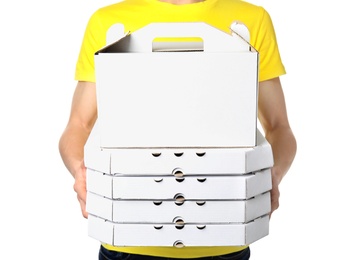 Photo of Courier with boxes on white  background, closeup. Food delivery service