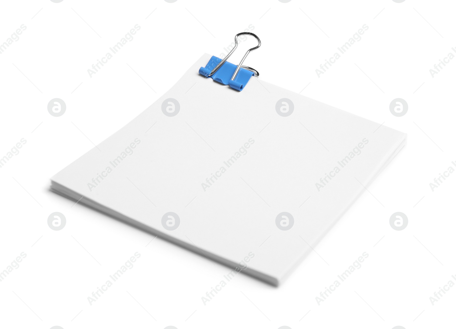 Photo of Note paper sheets with blue clip isolated white