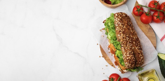 Image of Delicious sandwich with schnitzel on white table, flat lay. Banner design with space for text