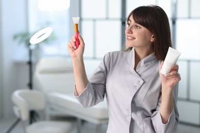 Photo of Cosmetologist with silicone brush and cosmetic product in clinic