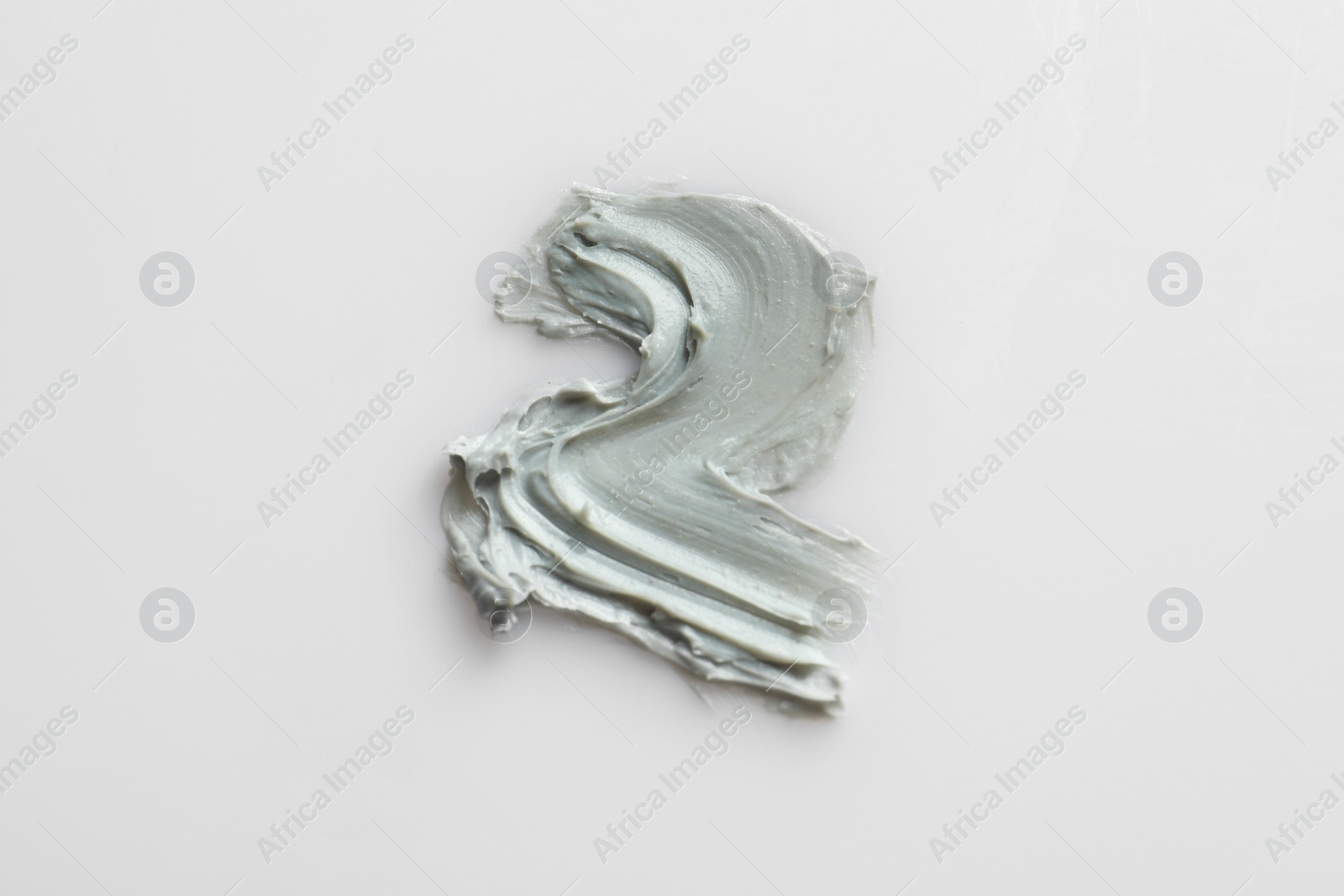 Photo of Sample of face mask on light background, top view