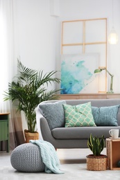 Photo of Living room interior with green houseplants and sofa