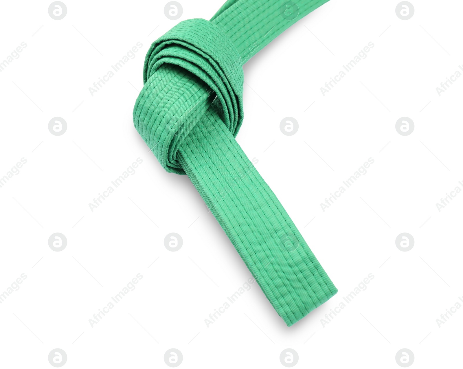 Photo of Green karate belt isolated on white. Martial arts uniform