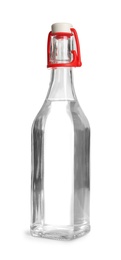 Glass bottle with vinegar on white background