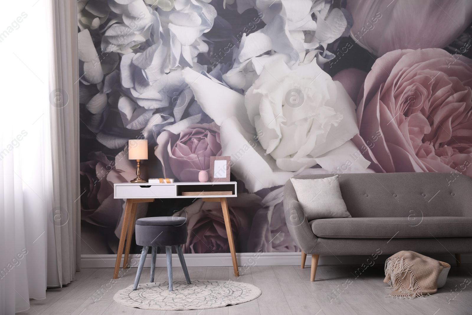 Photo of Beautiful room interior with stylish furniture and floral pattern on wall