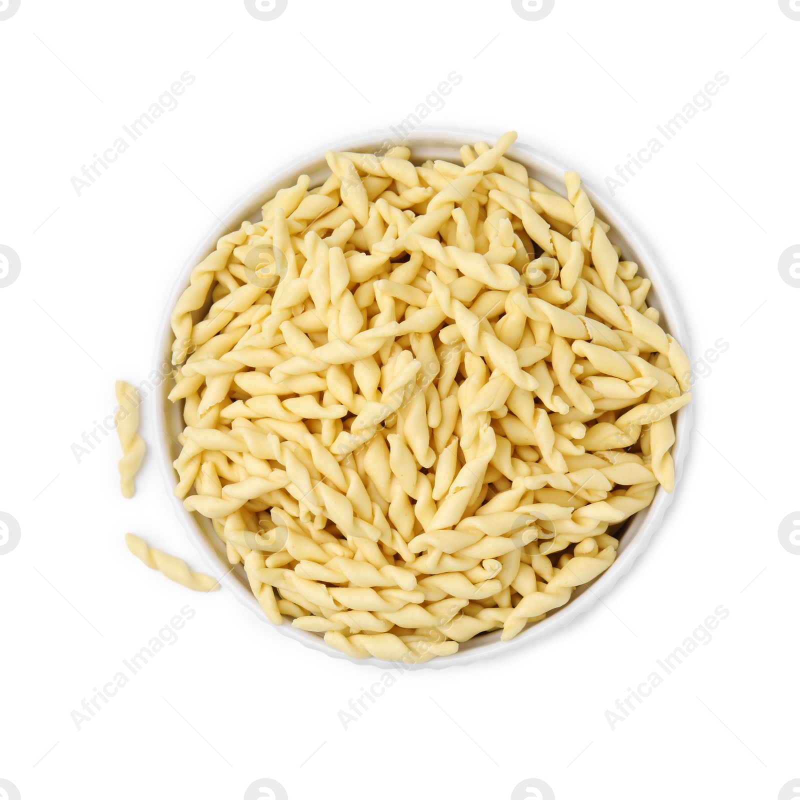 Photo of Bowl with uncooked trofie pasta isolated on white, top view