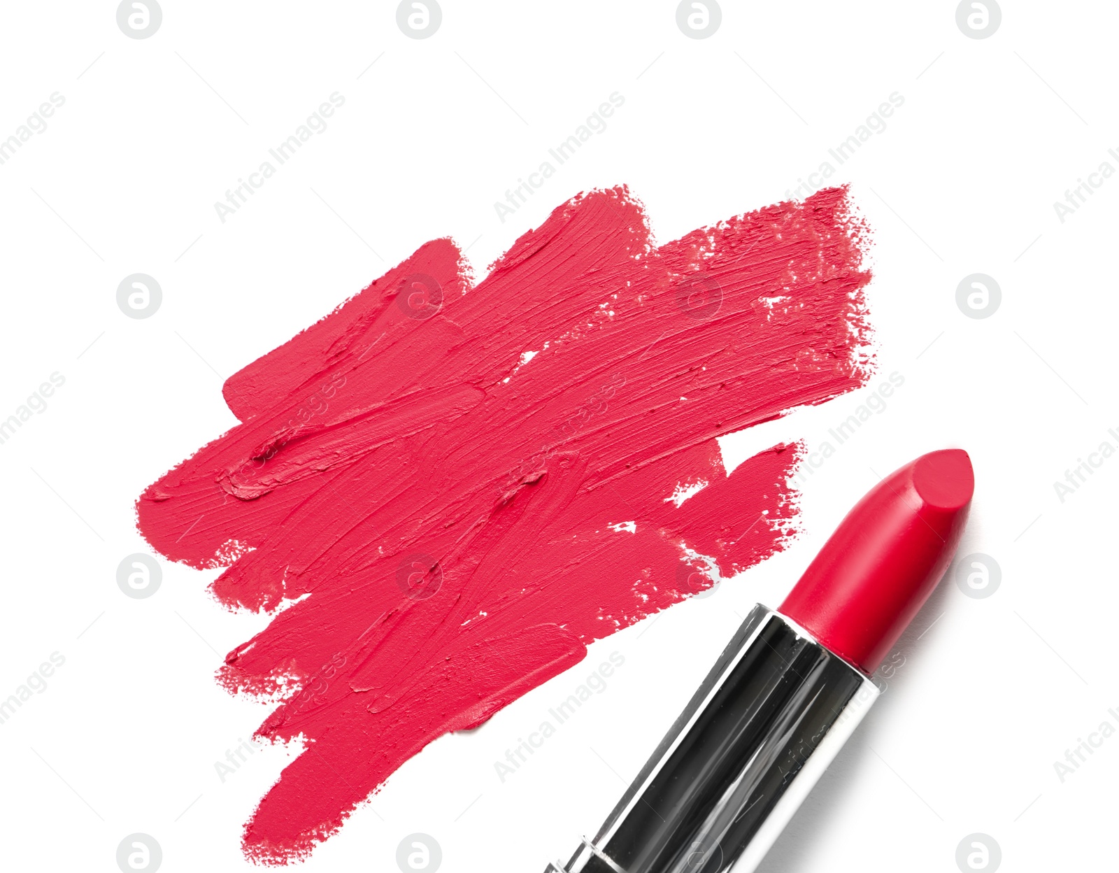 Photo of Tube of lipstick and smear isolated on white, top view