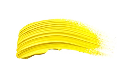 Photo of Yellow oil paint stroke on white background, top view