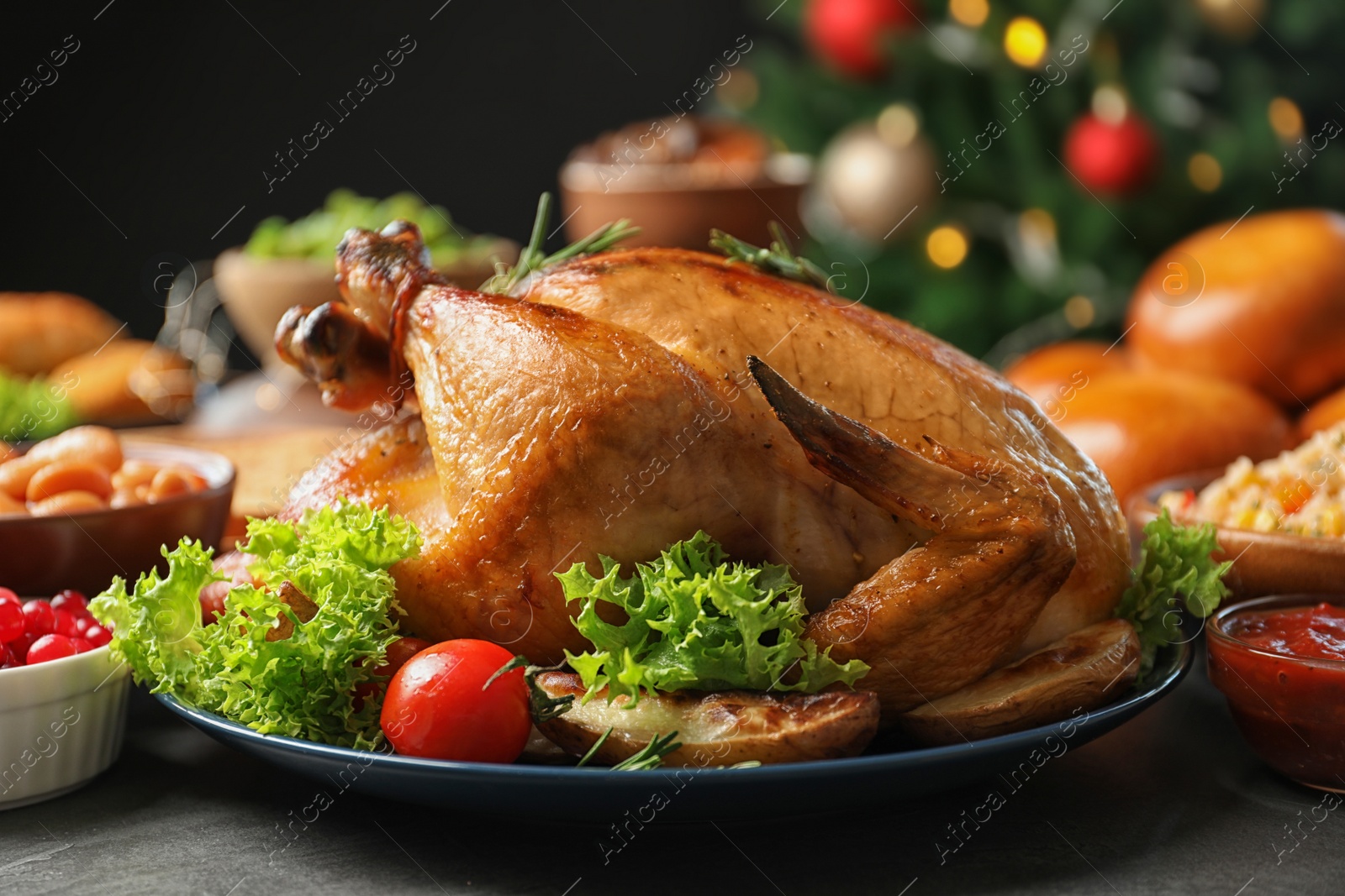 Photo of Traditional festive dinner with delicious roasted turkey served on table