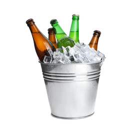 Photo of Metal bucket with bottles of beer and ice cubes isolated on white