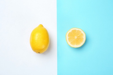 Photo of Flat lay composition with whole and sliced lemons on color background