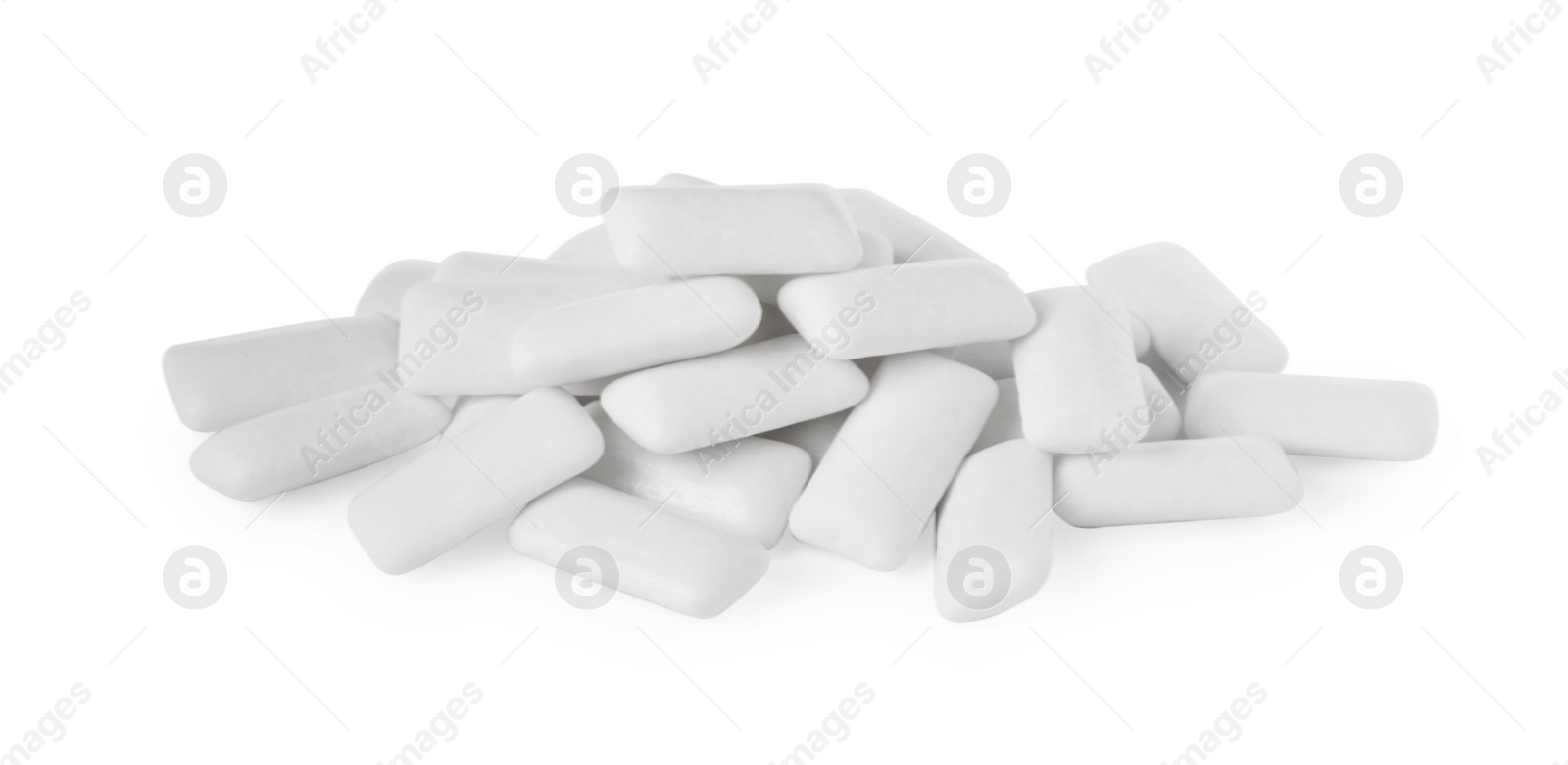 Photo of Pile of tasty chewing gums on white background