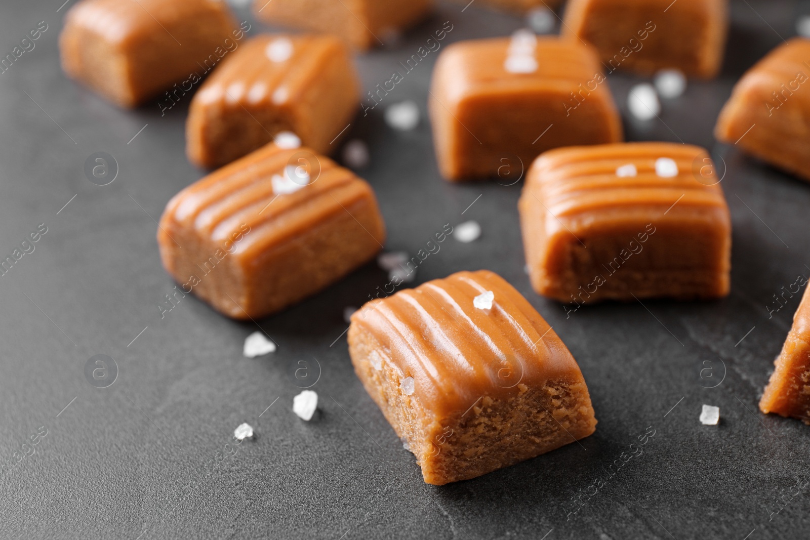 Photo of Salted caramel on grey table, closeup view