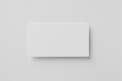 Photo of Blank business card on white background, top view. Mockup for design