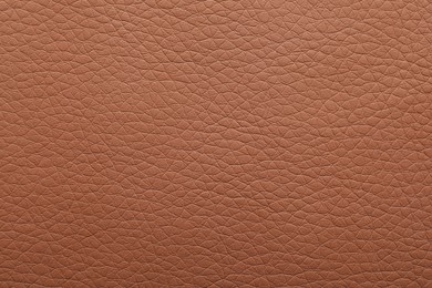 Photo of Texture of light brown leather as background, closeup