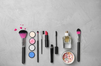 Flat lay composition with cosmetic products on grey background