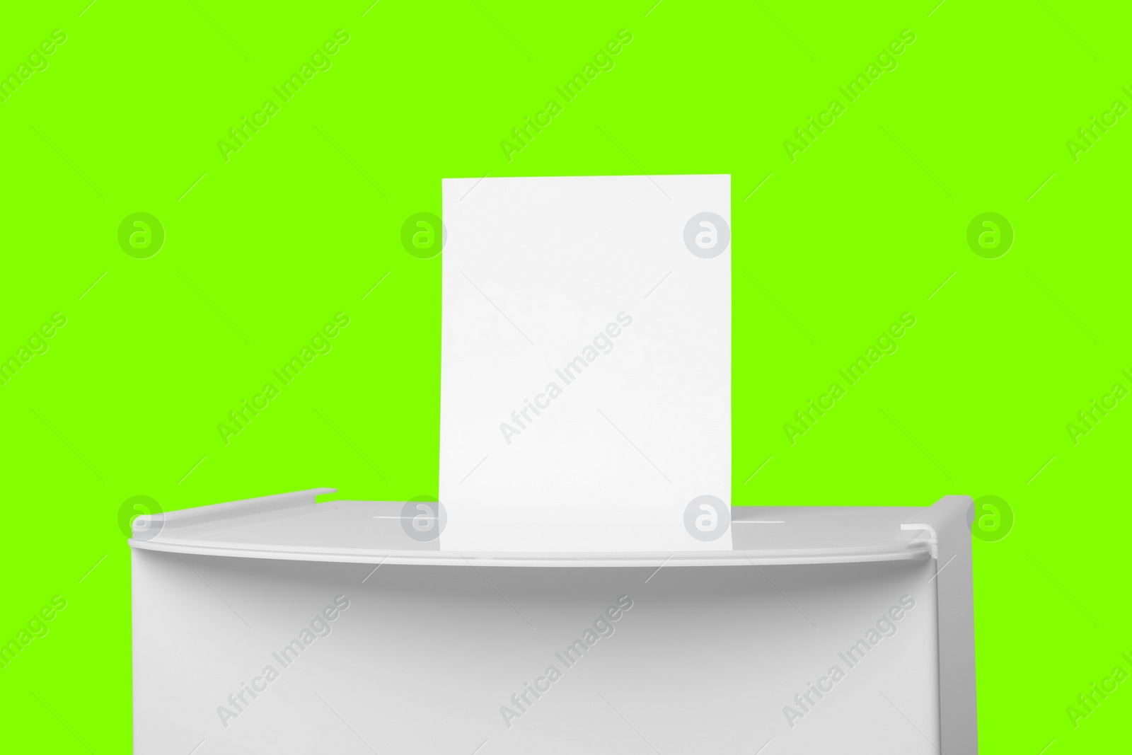 Image of Ballot box with vote on lime color background. Election time