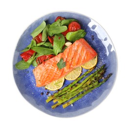 Photo of Tasty grilled salmon with tomatoes, asparagus, spinach and lemon isolated on white, top view