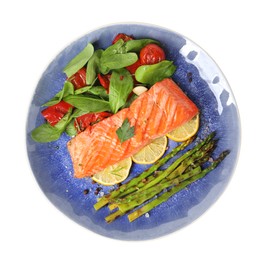 Tasty grilled salmon with tomatoes, asparagus, spinach and lemon isolated on white, top view