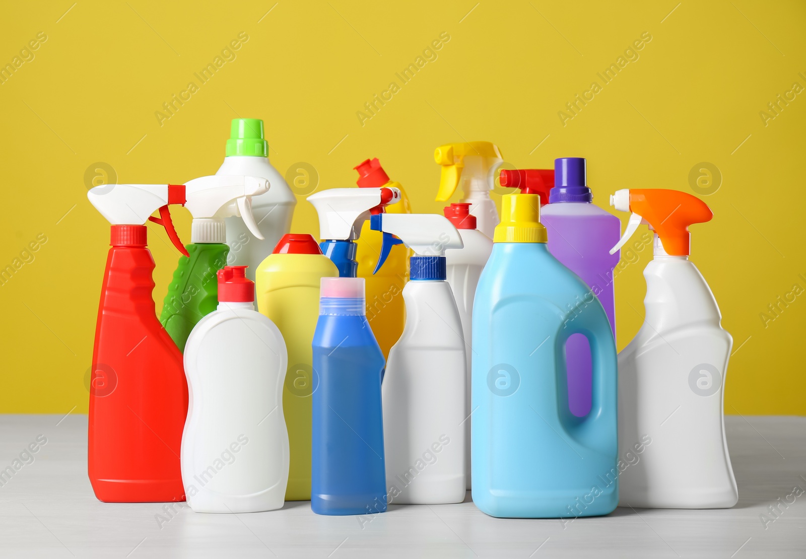 Photo of Bottles of different cleaning products on light table