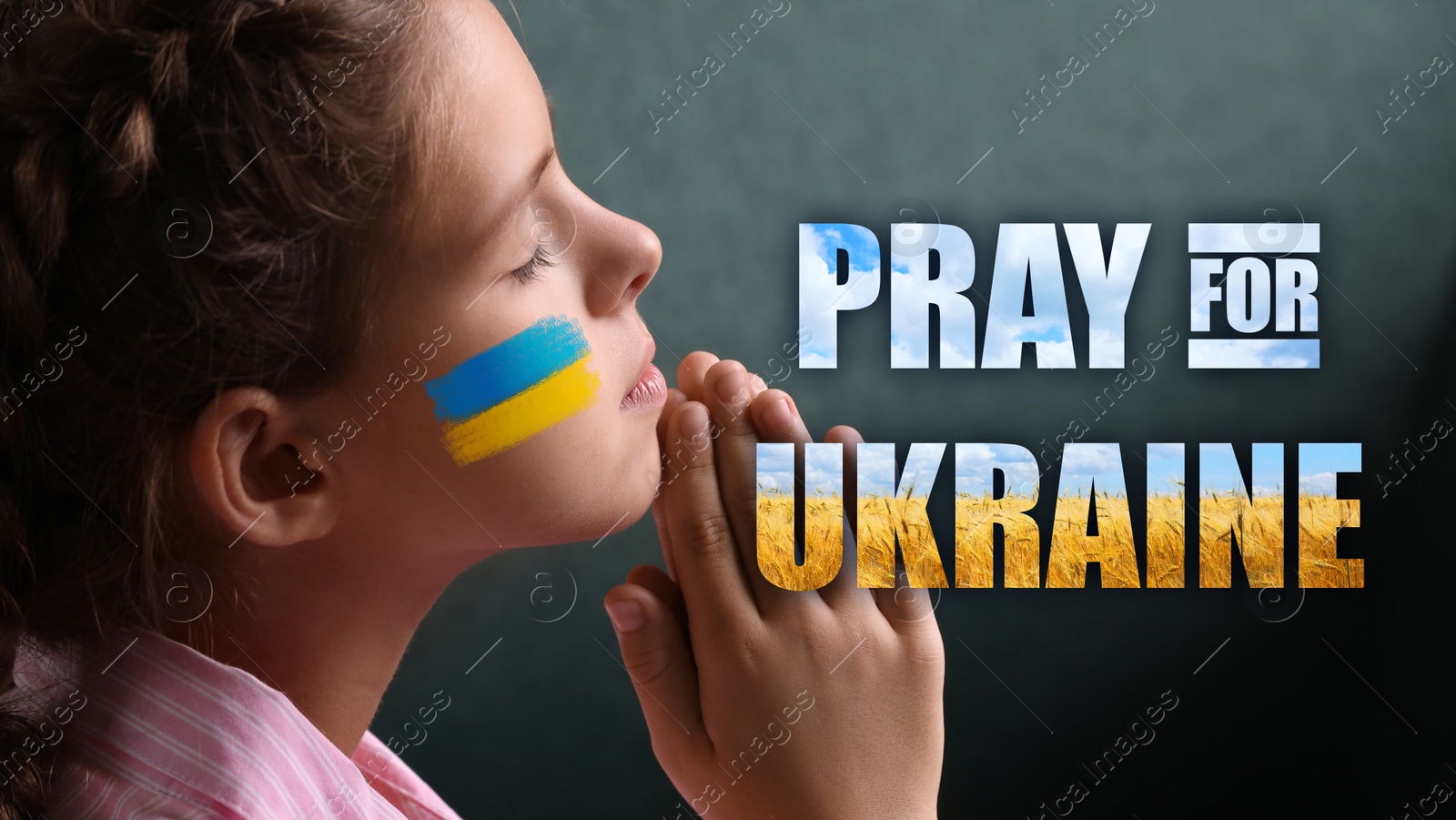 Image of Pray for Ukraine. Little girl with drawn Ukrainian flag on cheek and phrase