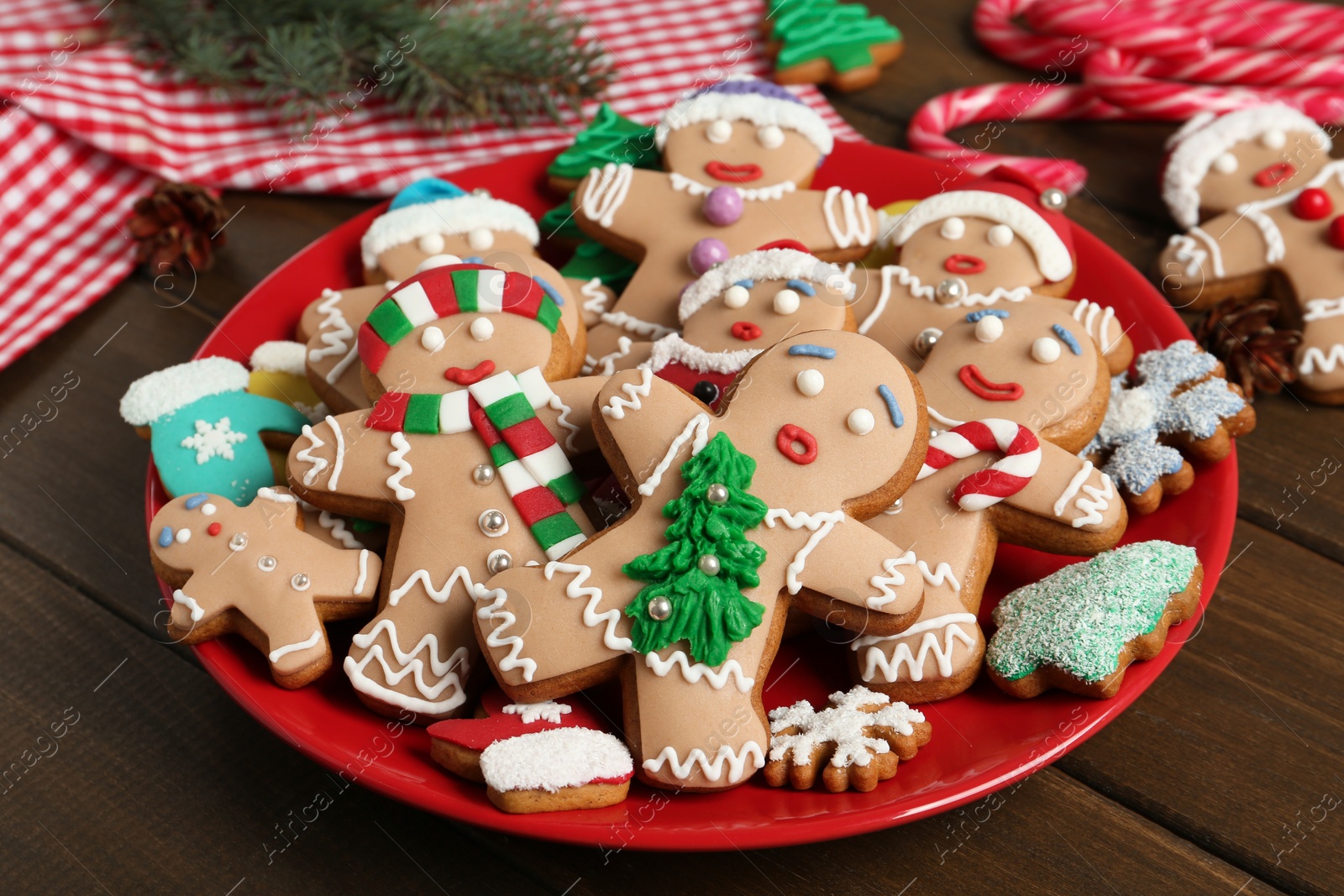 Photo of Delicious Christmas cookies on wooden table, closeup