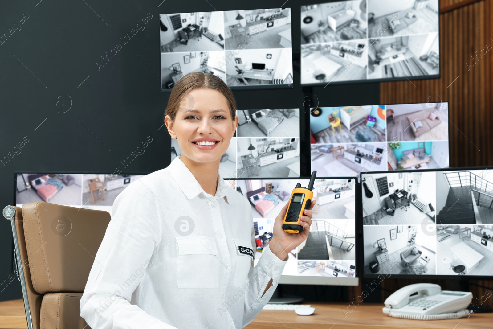 Photo of Security guard with portable transmitter at workplace