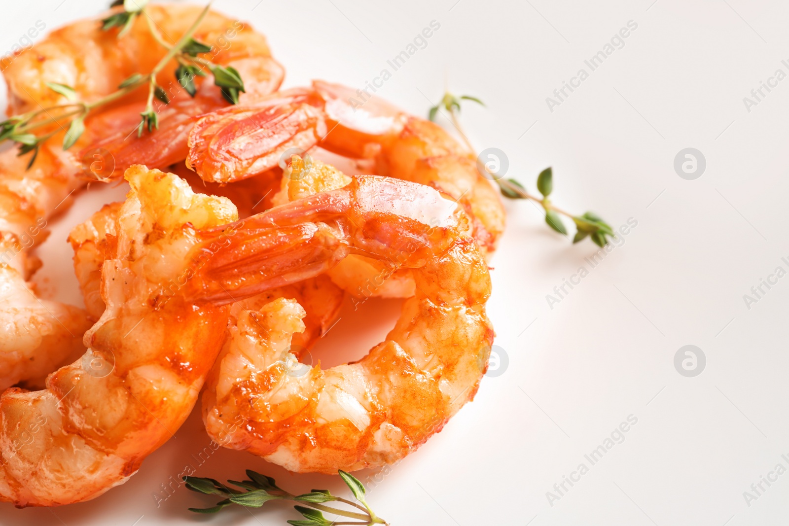 Photo of Delicious fried shrimps on light background, closeup