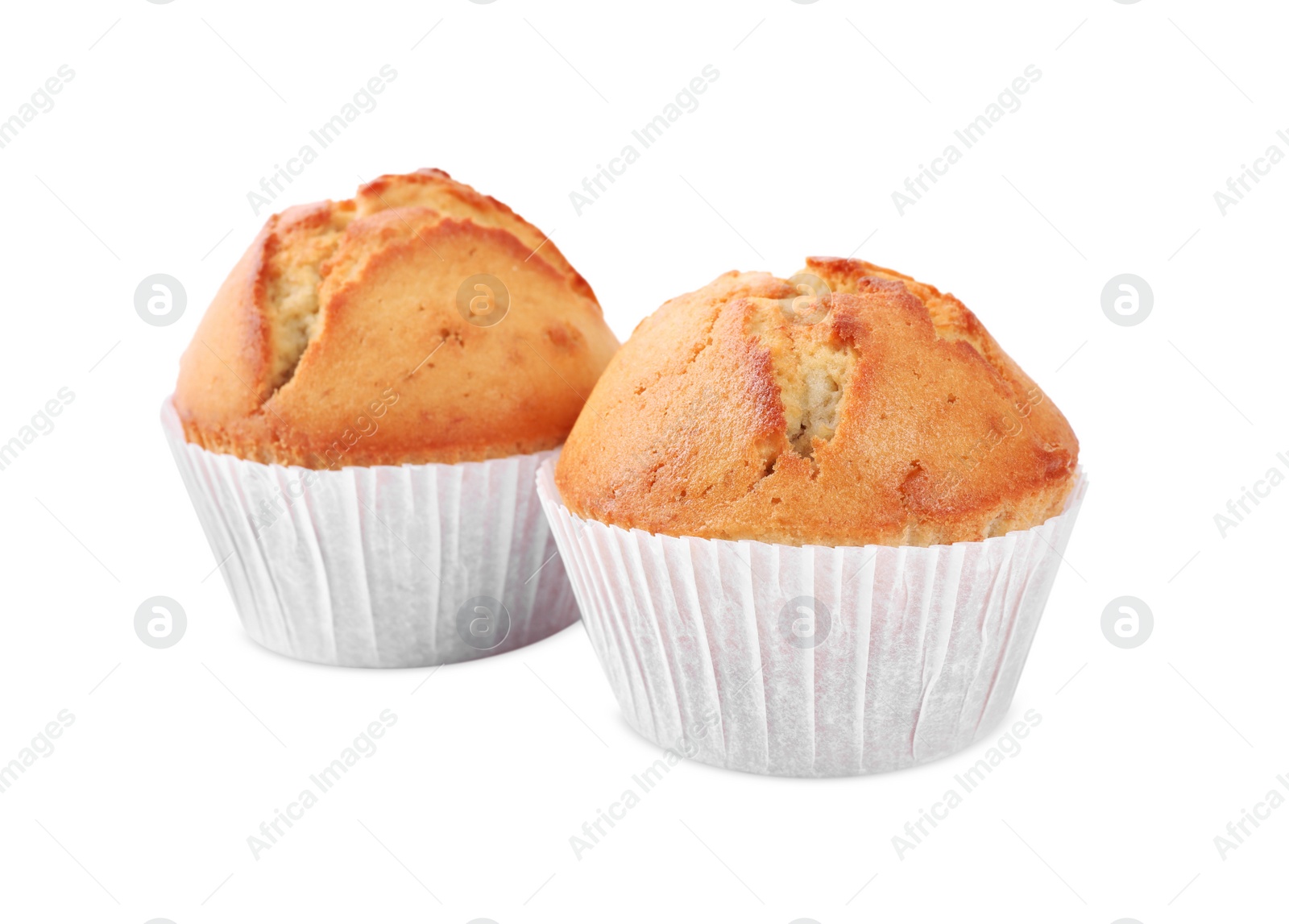 Photo of Tasty muffins in paper cups on white background