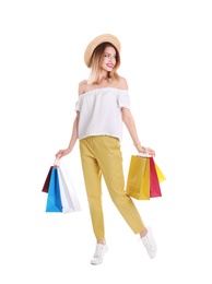 Photo of Beautiful young woman with shopping bags on white background