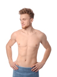 Portrait of young man with slim body in towel on white background