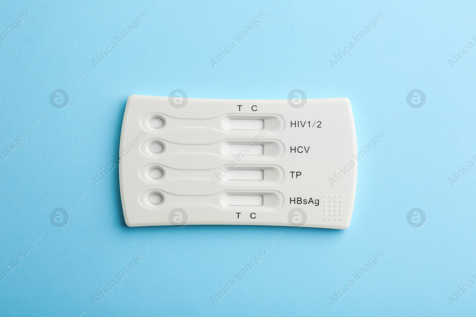 Photo of Disposable multi-infection express test on light blue background, top view