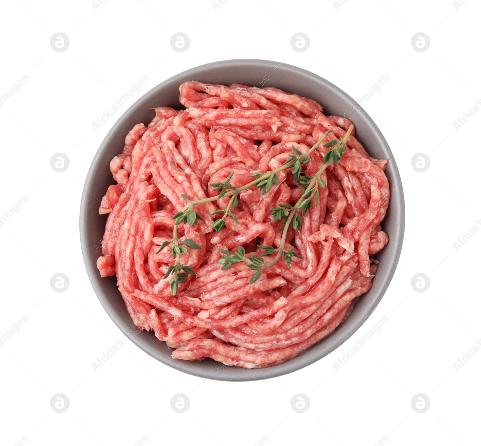 Photo of Fresh raw ground meat and thyme in bowl isolated on white, top view