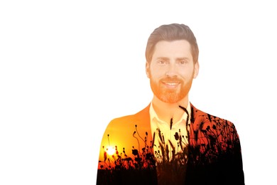 Double exposure of handsome businessman and plants in field at sunset