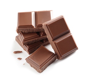 Pieces of tasty milk chocolate on white background