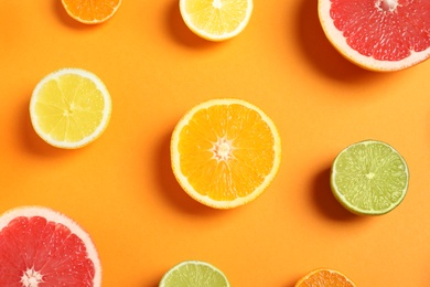 Photo of Different citrus fruits on color background, flat lay