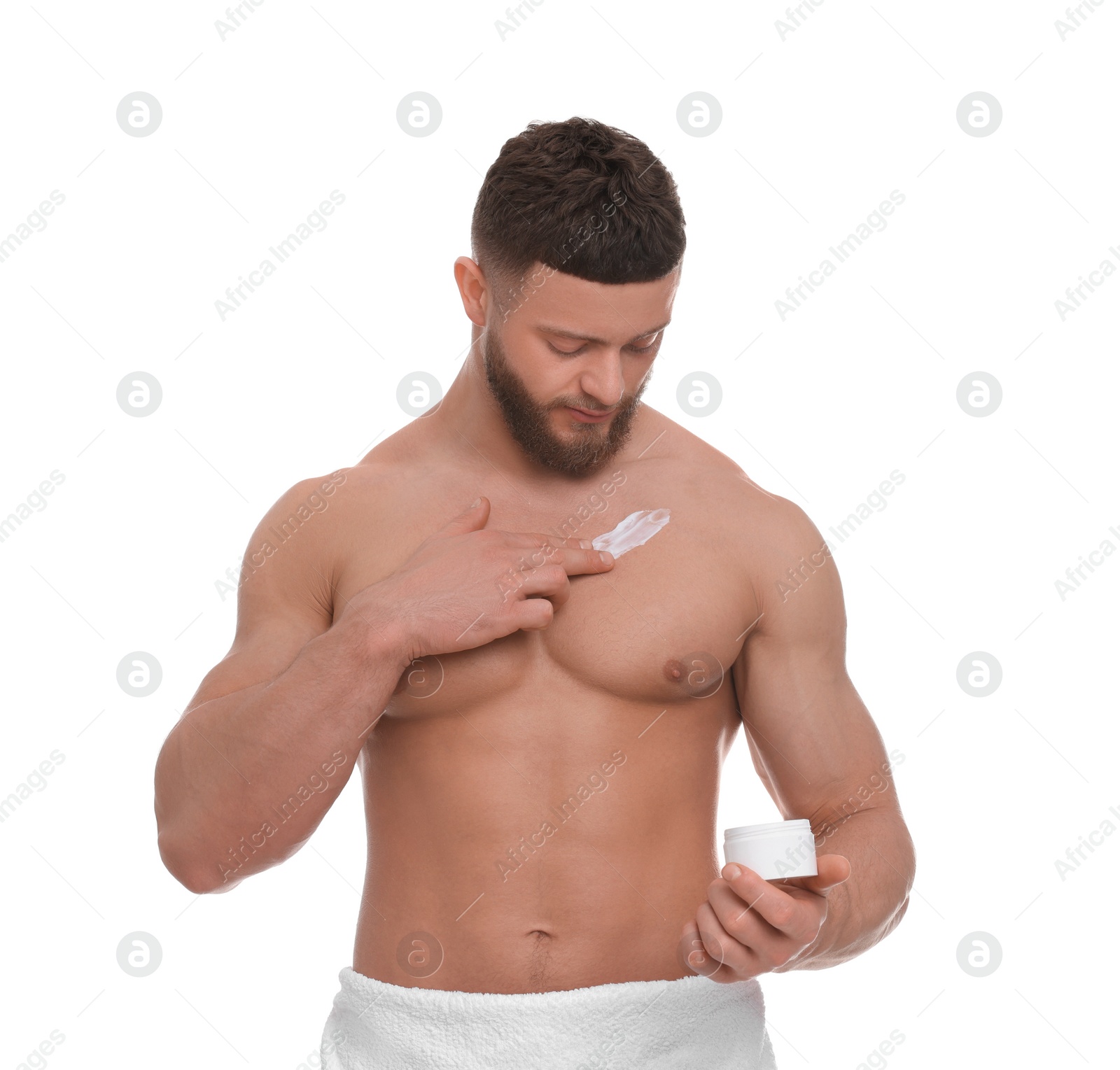 Photo of Handsome man applying body cream onto his chest on white background