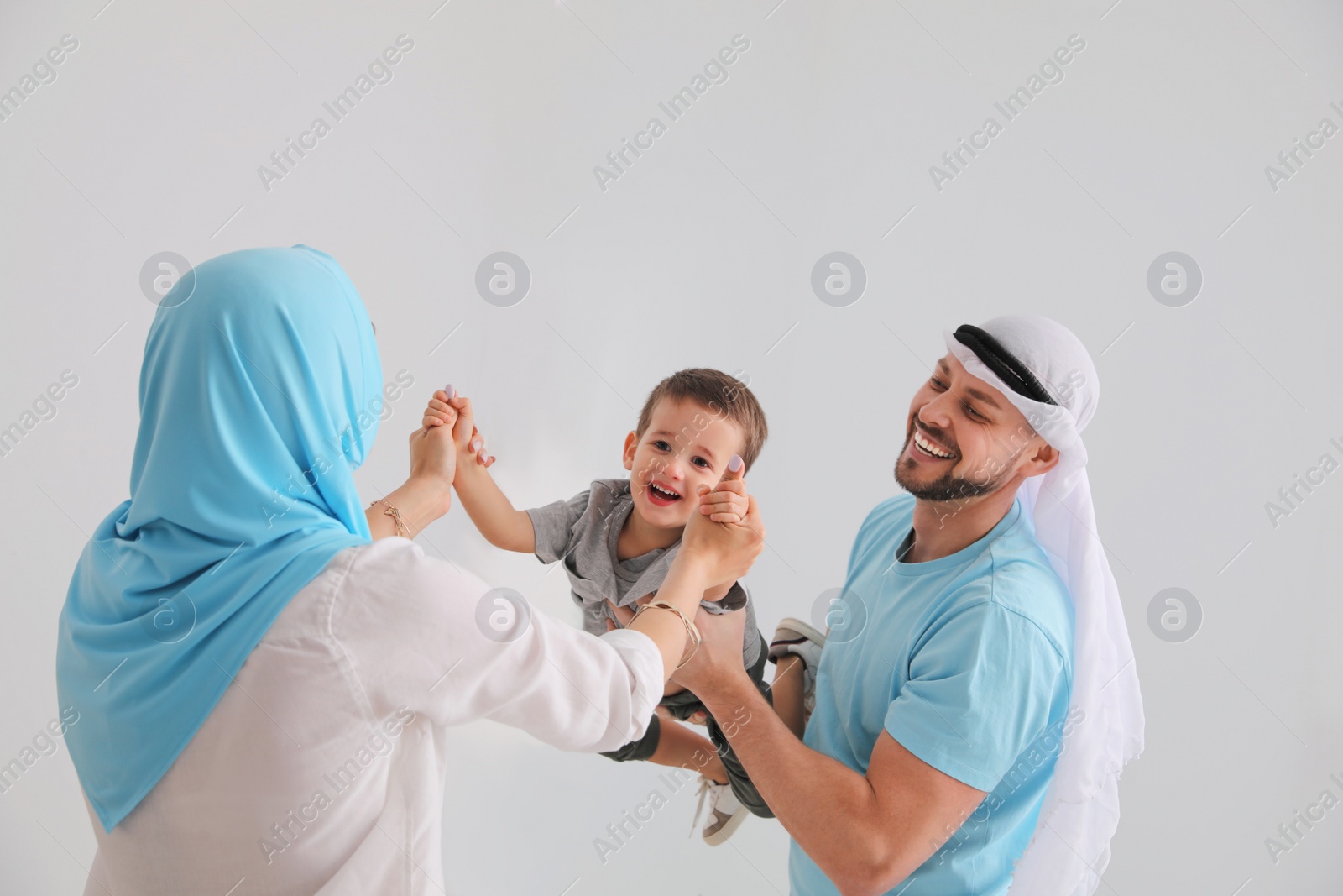 Photo of Happy Muslim family spending time together at home