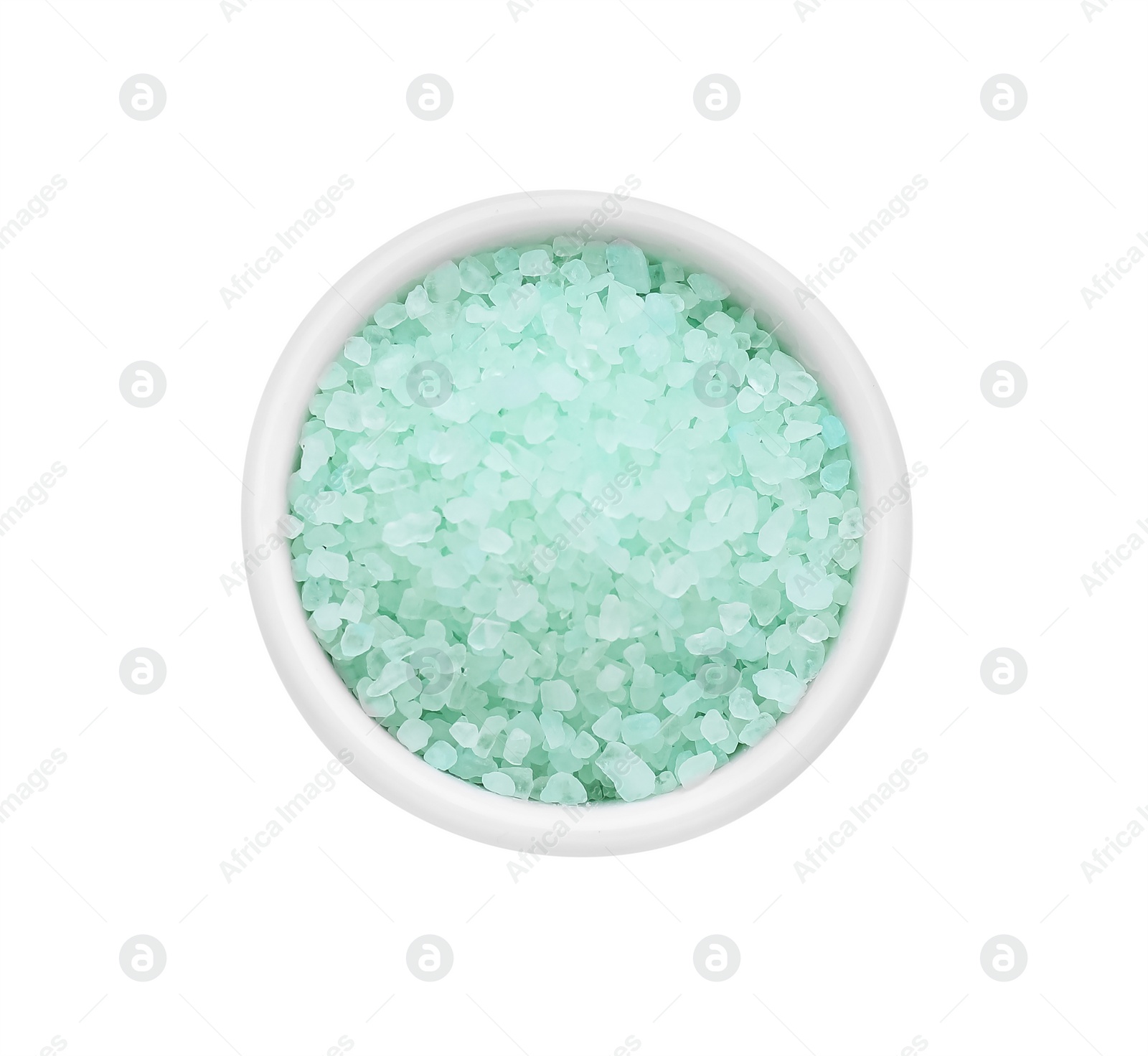 Photo of Bowl with turquoise sea salt isolated on white, top view