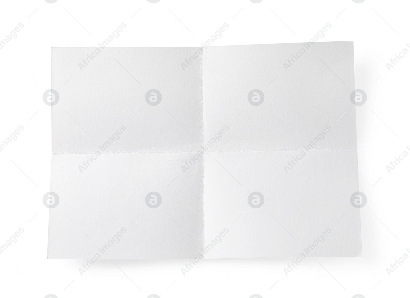 Photo of Blank paper sheet with creases isolated on white, top view