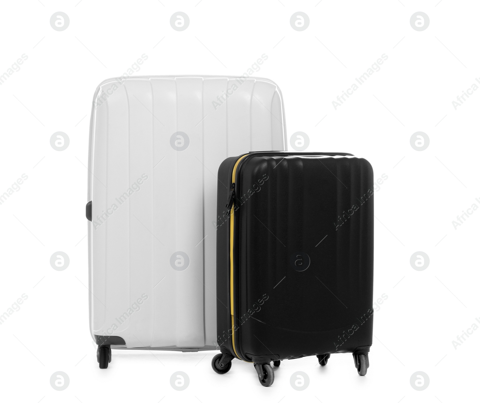 Photo of New suitcases packed for journey on white background