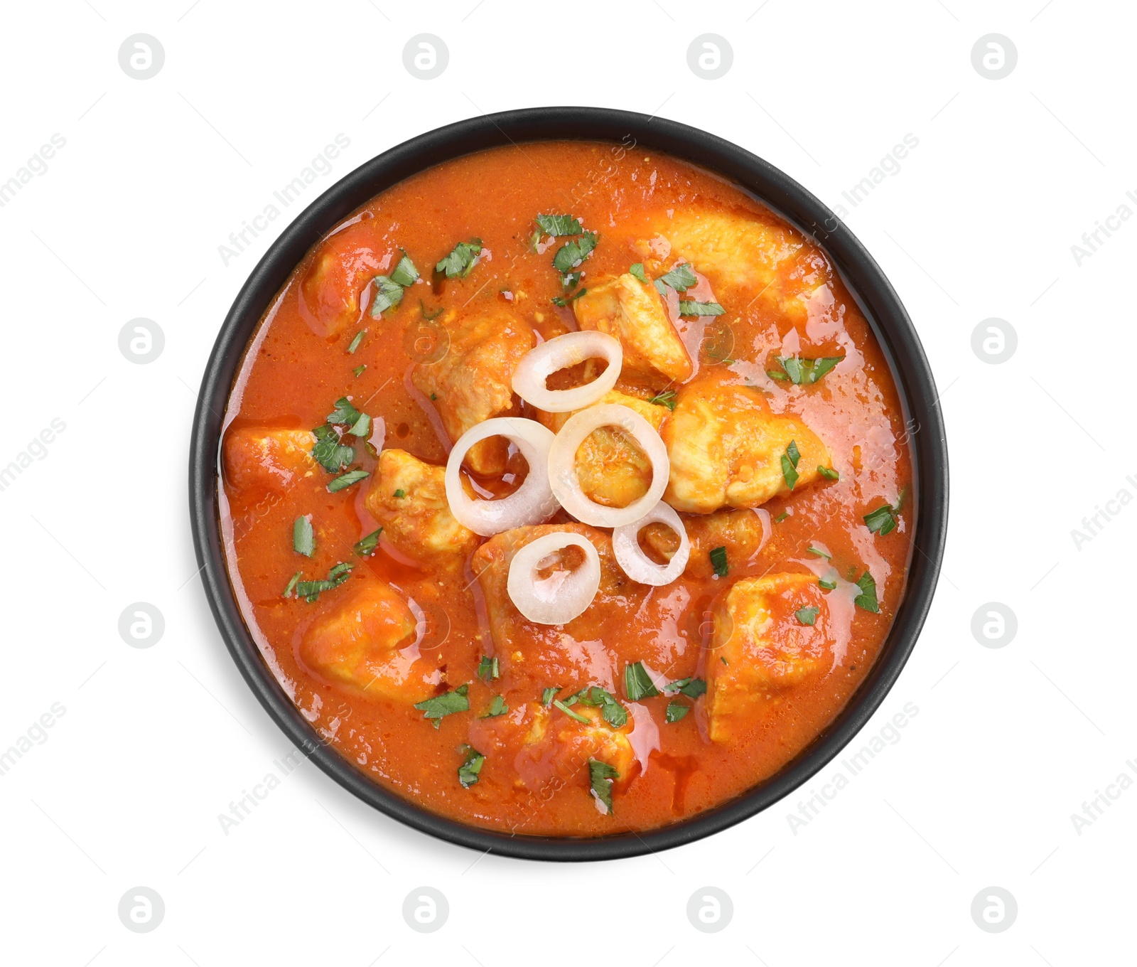 Photo of Bowl of delicious chicken curry on white background, top view