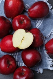 Photo of Fresh ripe red apples on grey table, flat lay