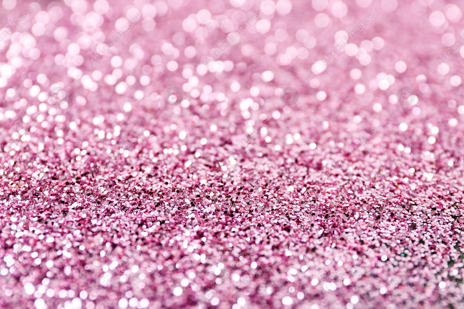 Photo of Texture of rose gold glitter as background, closeup
