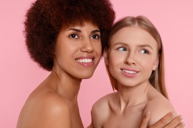 Photo of Portrait of beautiful young women on pink background