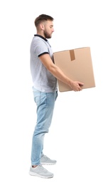 Photo of Full length portrait of young man carrying carton box on white background. Posture concept